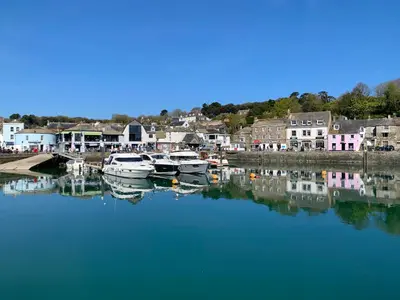 a group of boats are docked in a harbor at 2 Boathouse Terrace in Wadebridge