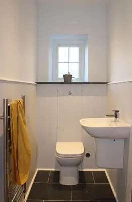 a bathroom with a white toilet and a sink at Truck House, Luxury accommodation, pet friendly, Probus in Truro