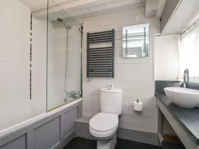 a bathroom with a toilet and a sink at An Skyber in Penzance