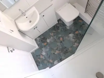 an overhead view of a bathroom with a sink and toilet at Spectacular Waterfront Views With Parking At 'Mariners Mirror' in Falmouth