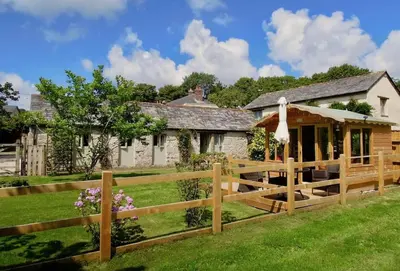 a wooden fence in front of a house at The Piggery in St Austell