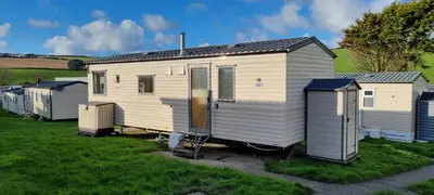 a group of mobile homes parked in a field at Coastal Retreat Newquay NB91 in Newquay