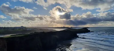 a view of the ocean with the sun shining at Coastal Retreat Newquay NB91 in Newquay