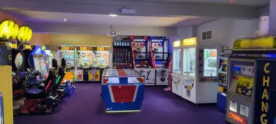 a room with arcade games and video game machines at Coastal Retreat Newquay NB91 in Newquay