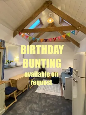 a kitchen with a birthday burning available on a room at Cosy Barn A rural location near Tintagel in Tintagel