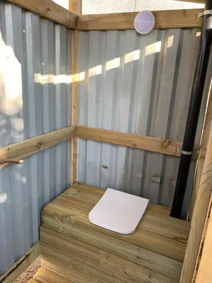 a white toilet sitting on top of a wooden platform at Rescorla Retreats - Blossom in St Austell