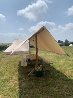 a tent and a bench in a field at Rescorla Retreats - Blossom in St Austell