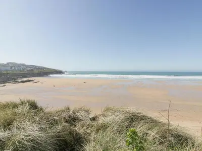 a sandy beach with the ocean in the background at Apartment 2 in Newquay