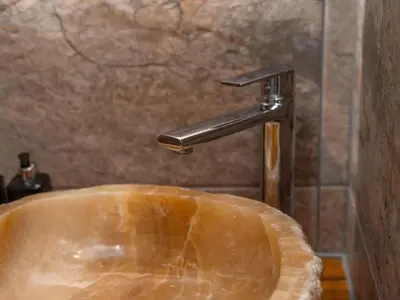 a sink with a water faucet in a bathroom at Holiday Home Sun Trap by Interhome in Newquay