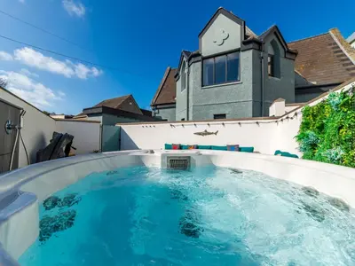 a swimming pool in the backyard of a house at Holiday Home Sun Trap by Interhome in Newquay