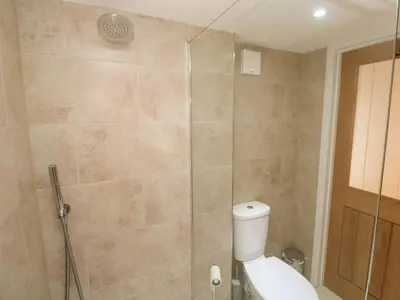 a bathroom with a toilet and a shower at Fair View in Truro