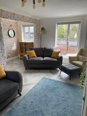 a living room with a couch and two chairs at 4 Bed House in Lovely Cornish Town in Saint Columb Major