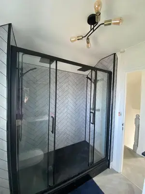a glass shower in a room with a ceiling at 4 Bed House in Lovely Cornish Town in Saint Columb Major