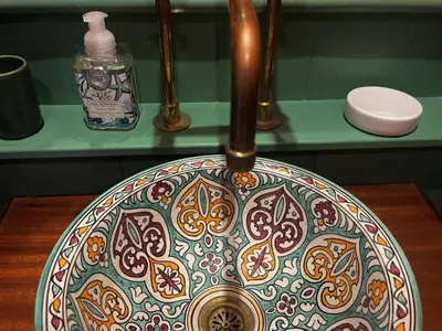 a colorful bowl on a table in a bathroom at The Moorings - Just a few metres from the sea! in Padstow