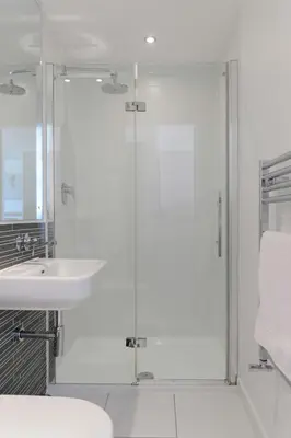 a bathroom with a shower and a sink at 6 Azure, Newquay in Newquay
