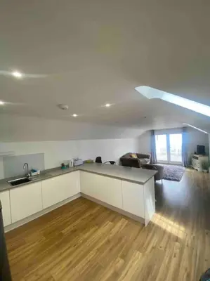 a room with a kitchen and a living room at Truro City Escape (self contained apartment) in Truro