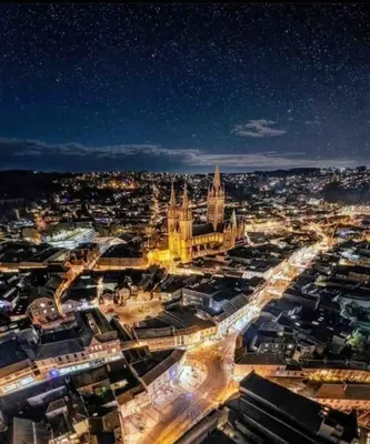 a view of a city at night with a building at Truro City Escape (self contained apartment) in Truro