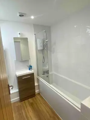 a bathroom with a shower and a sink at Truro City Escape (self contained apartment) in Truro