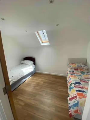 a small room with a bed and a window at Truro City Escape (self contained apartment) in Truro