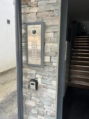a stone wall with a pay phone on it at Uno in the City - Urban Boutique Accommodation in Truro