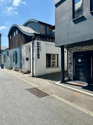 an empty street in front of a building at Uno in the City - Urban Boutique Accommodation in Truro