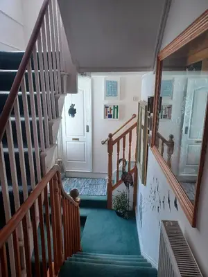 an overhead view of a hallway with stairs and a door at The Rookery in St Ives