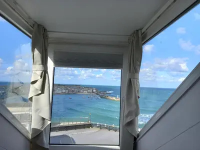 a window with a view of the ocean at The Rookery in St Ives