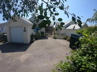 a driveway leading to a house with a garage at Gwel-an-Tansys in St. Agnes