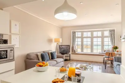 a kitchen and living room with a table with fruit on it at 2 Bed in St. Ives oc-h28027 in St Ives