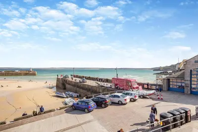 a view of a beach with cars parked on a pier at 2 Bed in St. Ives oc-h28027 in St Ives