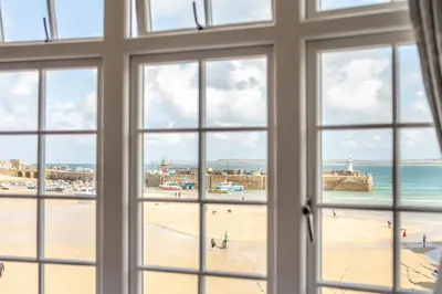 a view of a beach from a window at 2 Bed in St. Ives oc-h28027 in St Ives