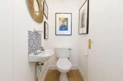 a bathroom with a toilet and a sink at Lanyon in St Ives