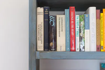 a book shelf filled with lots of books at Lanyon in St Ives