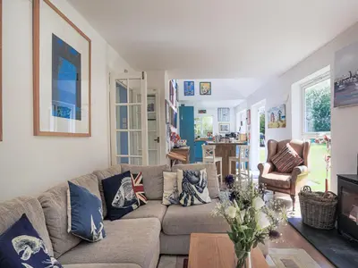 a living room with a couch and a table at 31 Lower Elms in Saint Minver