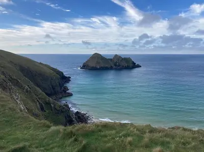 an island in the middle of the ocean on a hill at Cubert Nr Newquay Traditional 16th century cottage in Cubert
