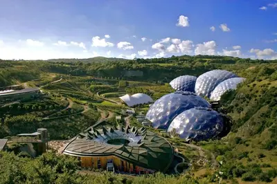 a group of domes in a field with trees at Cubert Nr Newquay Traditional 16th century cottage in Cubert