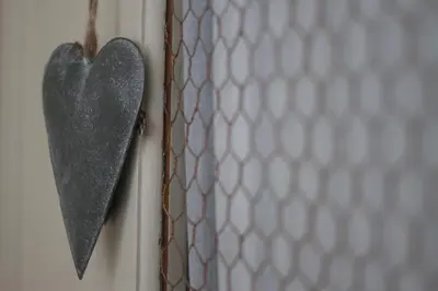 a heart hanging on a door next to a tie at Fairfield Apartment in St Ives