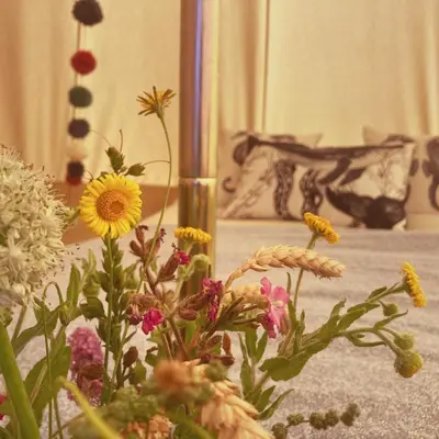 a vase filled with flowers in a room at Foxglove Field Glamping in Perranuthnoe