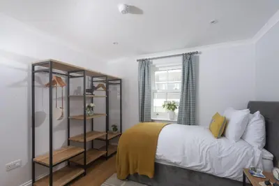 a bedroom with a bed and a window at 7 Wheal Ayr, St Ives in St Ives