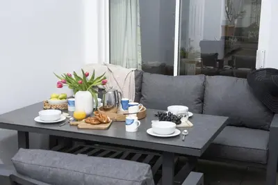 a coffee table with food on it in a living room at 7 Wheal Ayr, St Ives in St Ives
