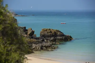 a view of a beach with a boat in the water at 7 Wheal Ayr, St Ives in St Ives