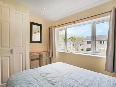 a bedroom with a bed and a window at Manor Haven - Atlantic Reach in Saint Columb Major
