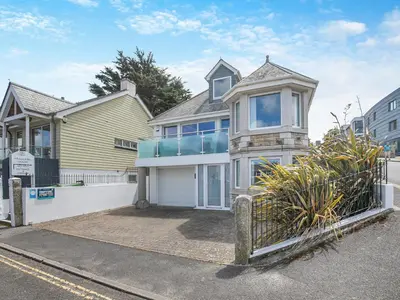a house with a gate in front of it at Chapel View in Carbis Bay
