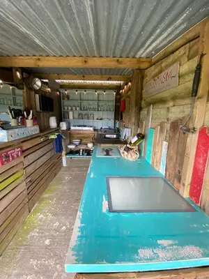 a kitchen with blue counter tops in a room at Sunrise Cabin in Carbis Bay