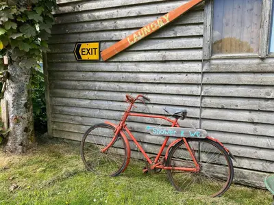 a red bike parked in front of a house at Sunrise Cabin in Carbis Bay