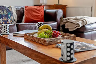 a tray of fruit on a coffee table in a living room at 3 Bed in Looe oc-w29227 in Looe