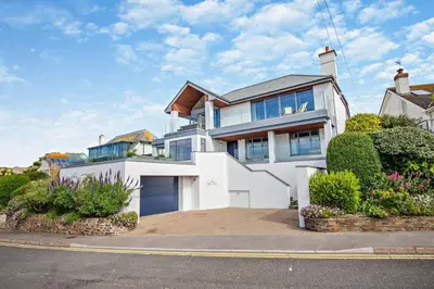 a large white house with a driveway at 6 Bed in Newquay oc-e18072 in Newquay