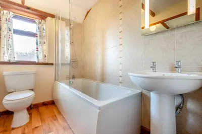 a bathroom with a sink and a tub and a toilet at 3 Bed in St. Merryn oc-m29320 in St Merryn