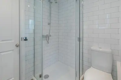 a bathroom with a glass shower with a toilet at 3 Bed in Golant oc-o29307 in Golant