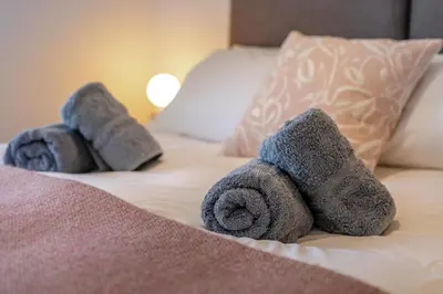 a pair of towels sitting on top of a bed at 3 Bed in Golant oc-o29307 in Golant